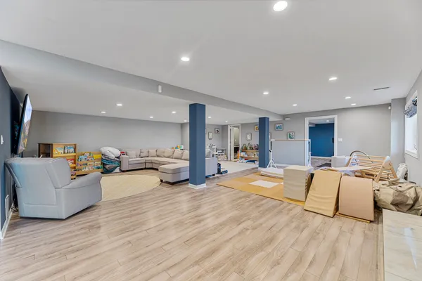 a living room with lots of furniture and a flat screen tv
