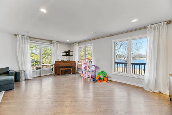 a bedroom with furniture and a window