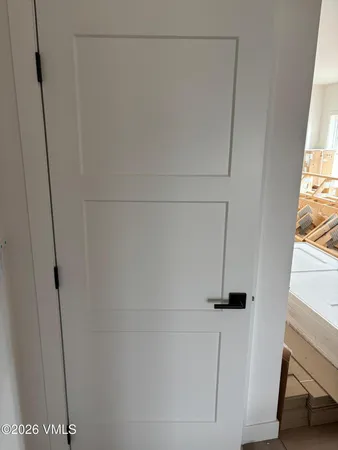 a view of walk in closet with clothes