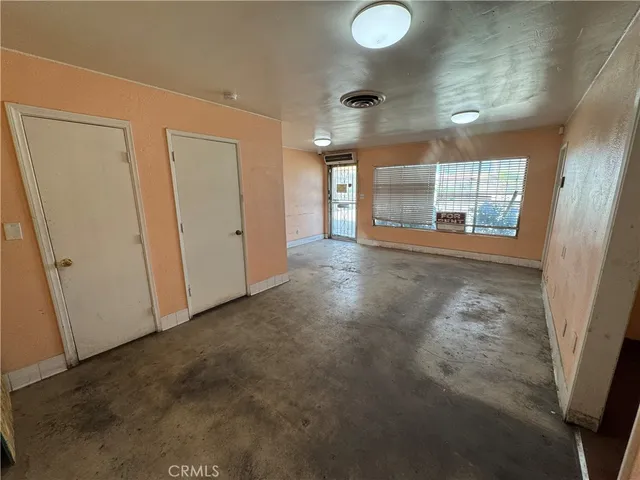 a view of a hallway with windows