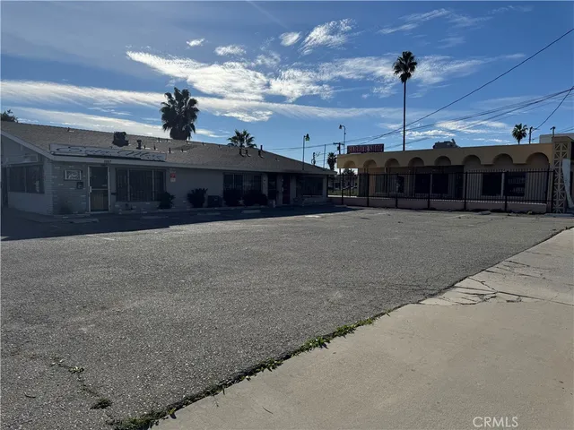 a view of a house with a outdoor space and sitting area