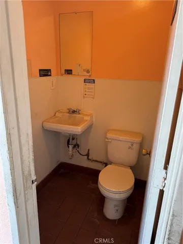a bathroom with a toilet and a sink