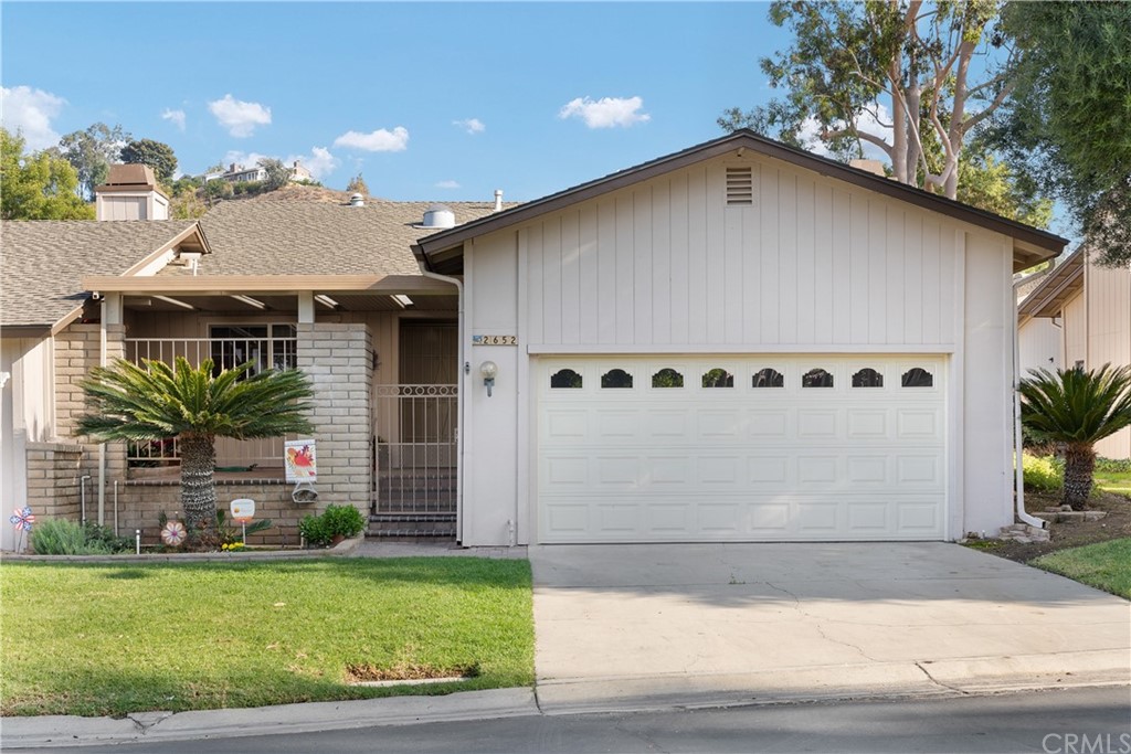 2652 Laramie Road Riverside, CA 92506 - Photo 1 of 1 a front view of a house with garden