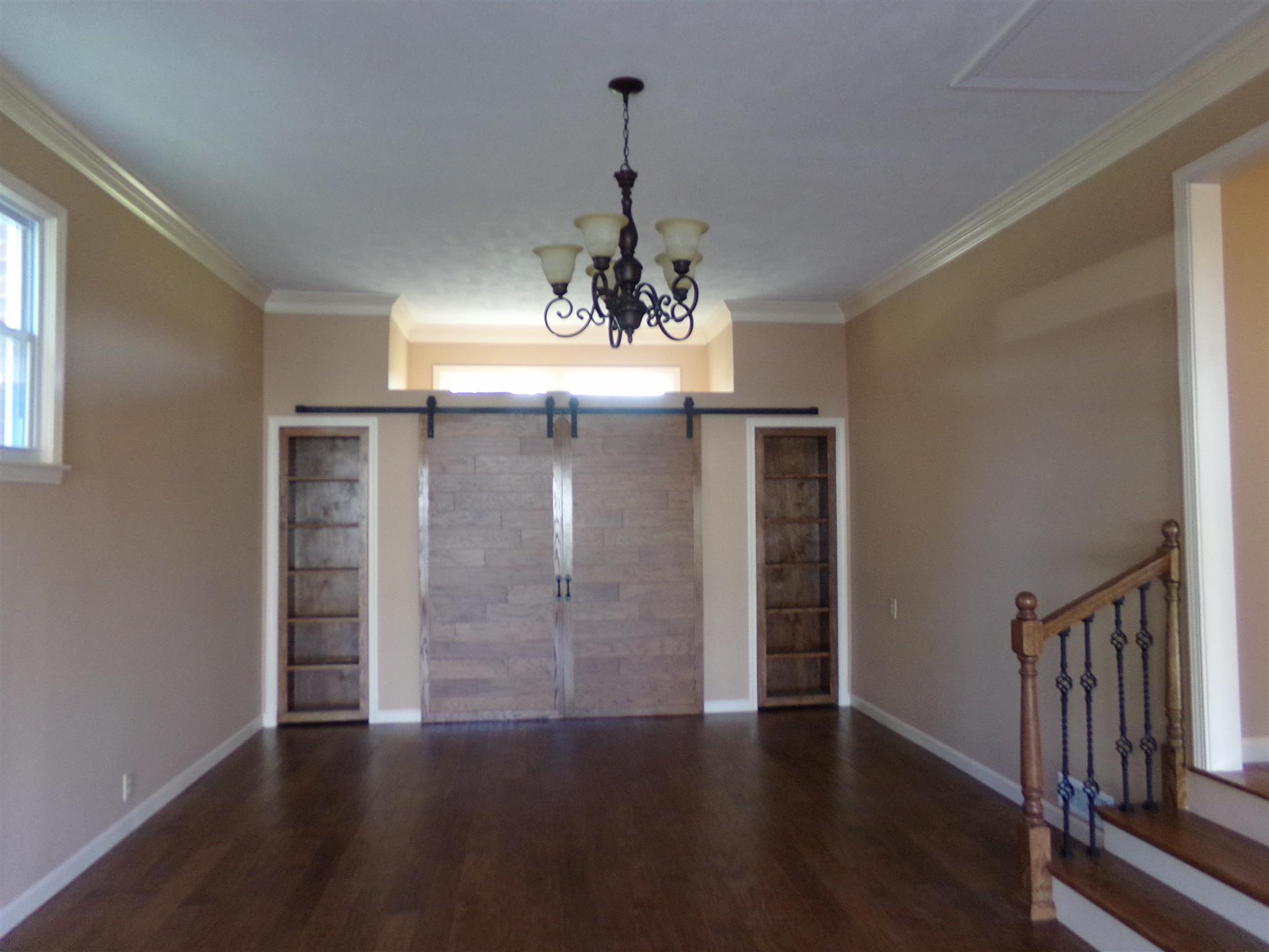 213 Airport Road Portland, TN 37148 - Photo 11 of 16 an empty room with wooden floor closet and windows