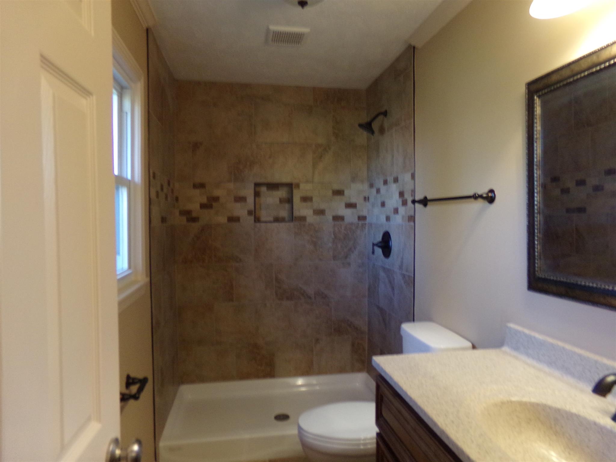 213 Airport Road Portland, TN 37148 - Photo 14 of 16 a bathroom with a sink toilet and shower