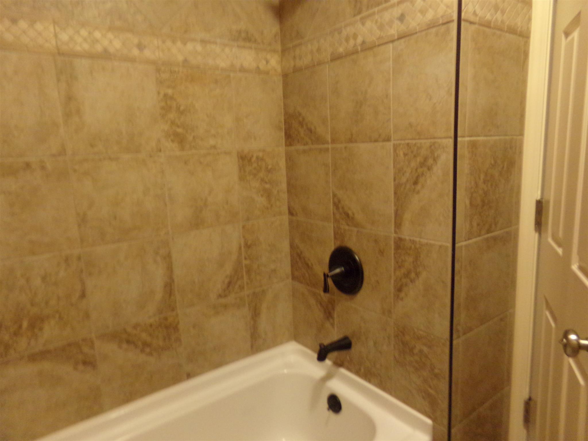 213 Airport Road Portland, TN 37148 - Photo 15 of 16 a bathroom with a shower and a sink
