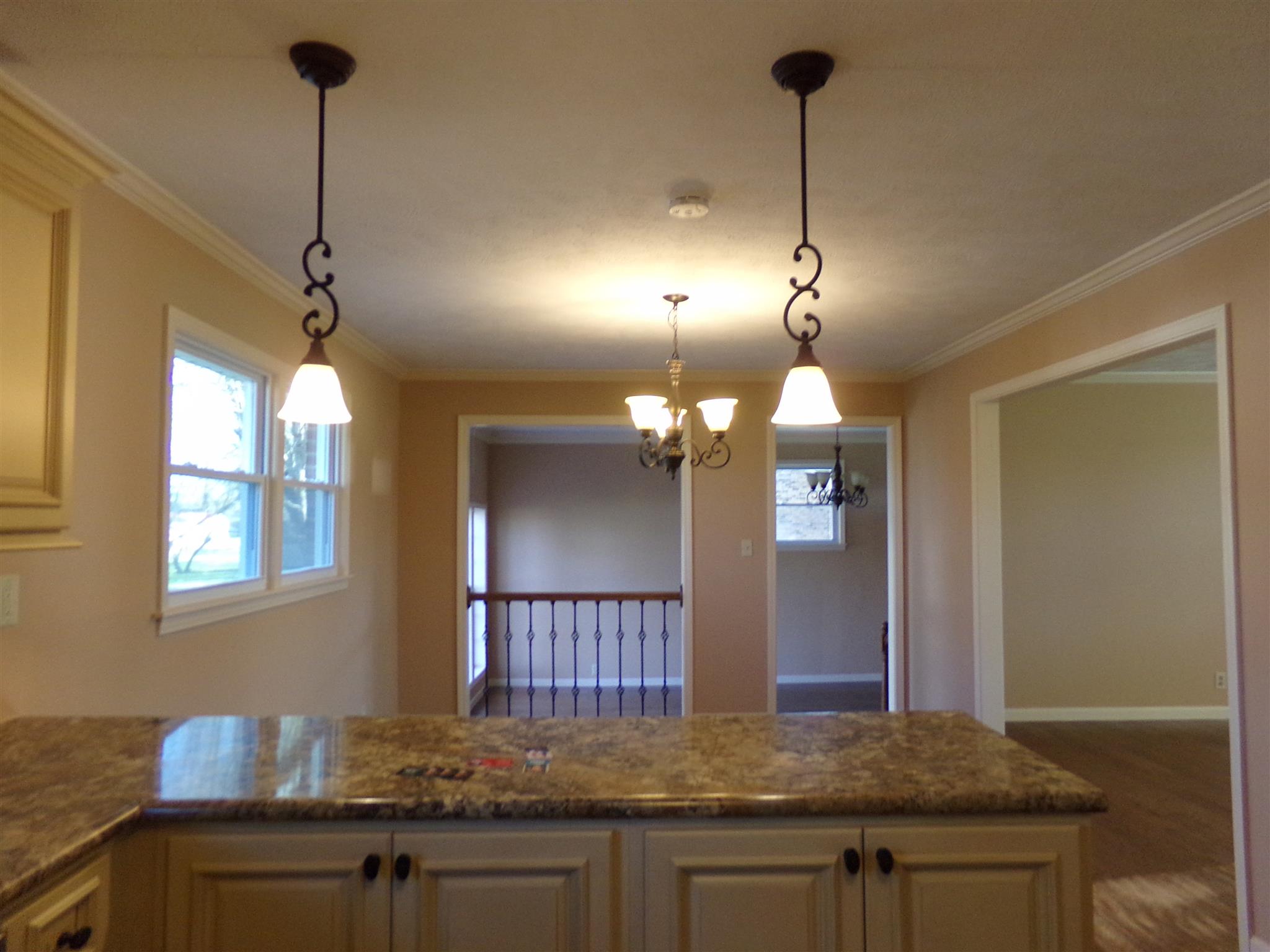 213 Airport Road Portland, TN 37148 - Photo 7 of 16 a kitchen with kitchen island granite countertop cabinets and wooden floor