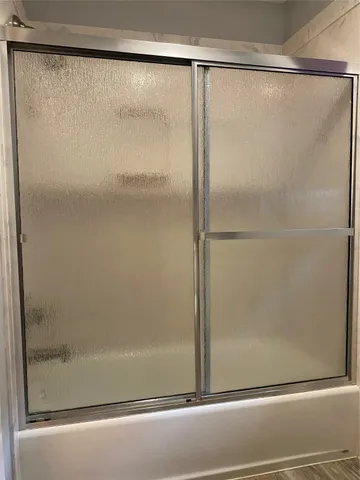 a bathroom with a glass shower