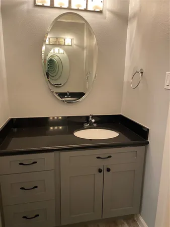 a white toilet sitting next to a shower