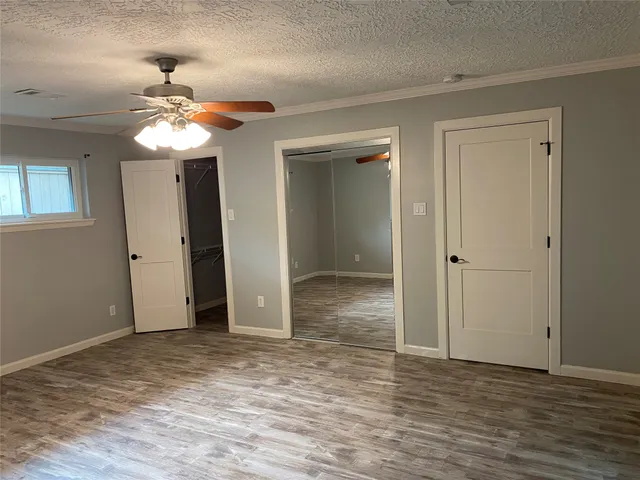 a bathroom with a black and white checkered floor
