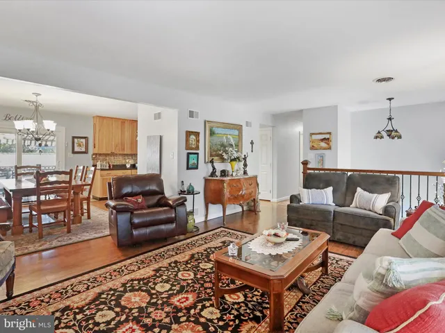 a living room with furniture and a rug