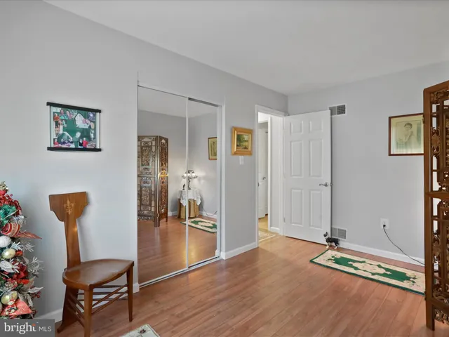 a view of room with furniture and wooden floor