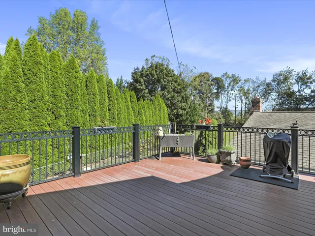 a view of a chair and tables in the balcony