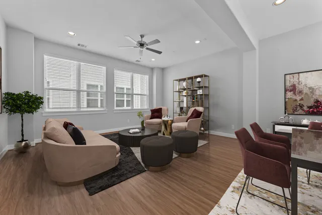 a living room with furniture or couch and a potted plant