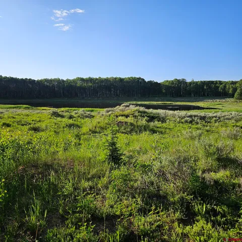 a view of a lake with sunset view