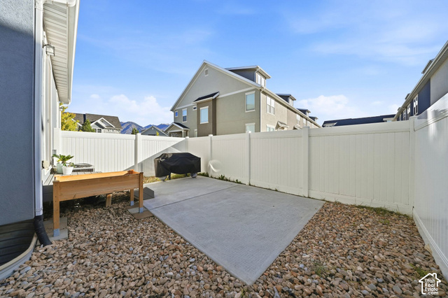 1081 Bowery Way Mapleton, UT 84664 - Photo 31 of 41 Concrete patio with surrounding gravel landscaping