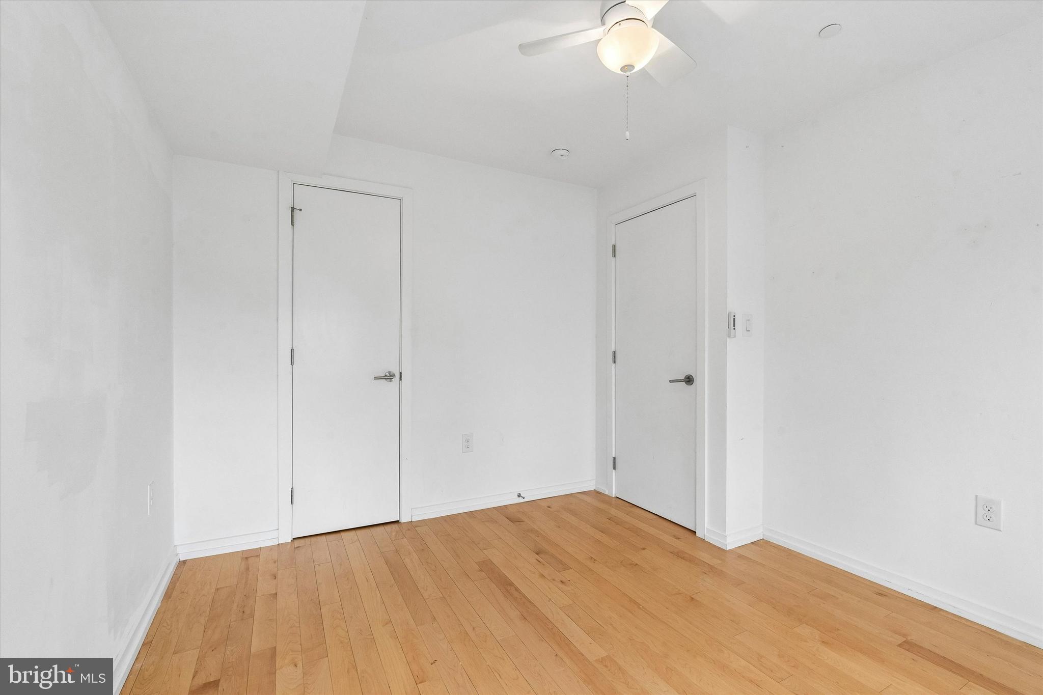 936 North Leithgow Street Philadelphia, PA 19123 - Photo 12 of 40 a view of a room with a bed and a chandelier