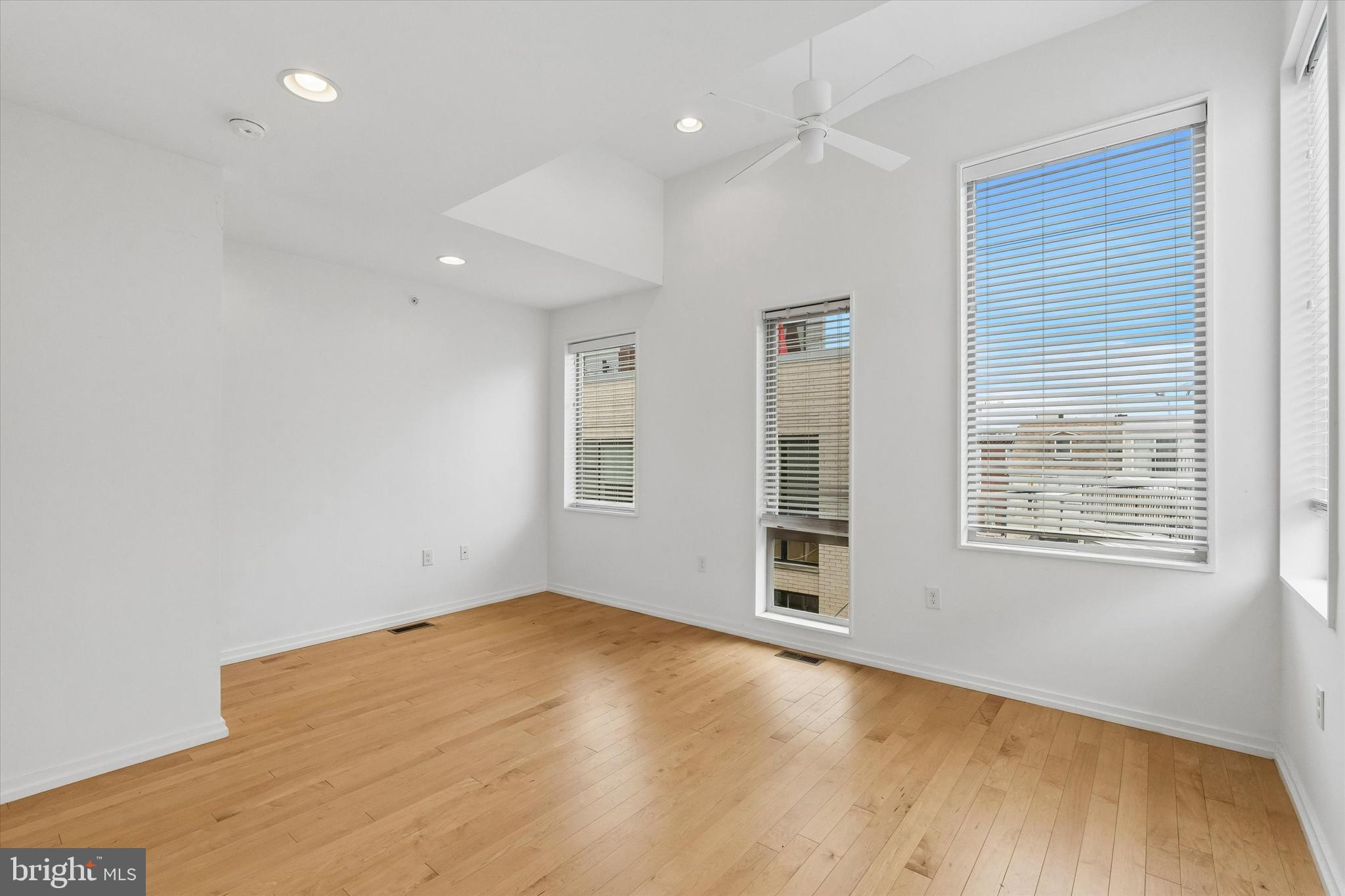 936 North Leithgow Street Philadelphia, PA 19123 - Photo 21 of 40 wooden floor in an empty room with a window