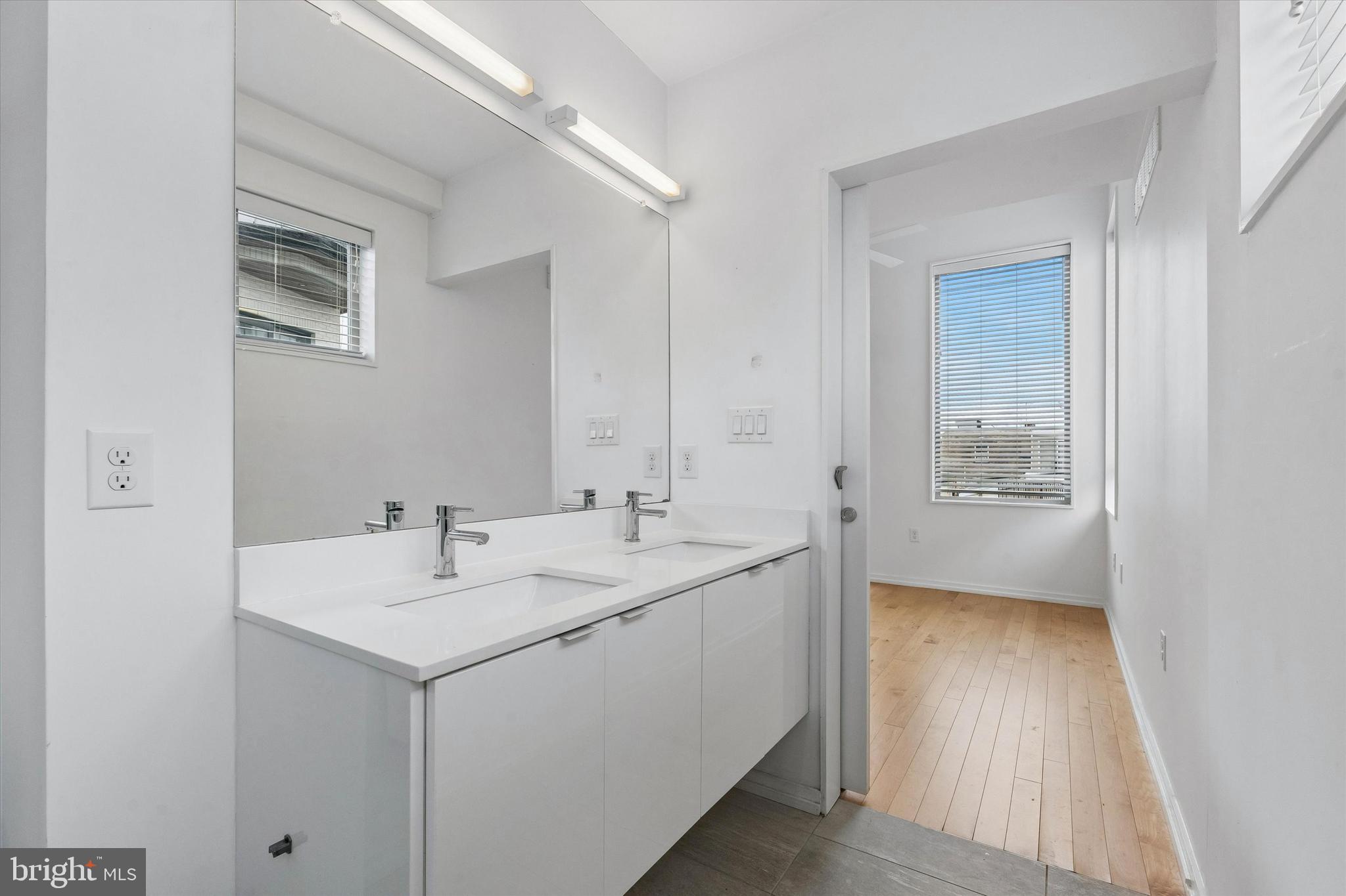 936 North Leithgow Street Philadelphia, PA 19123 - Photo 22 of 40 a view of a bathroom with a sink and mirror