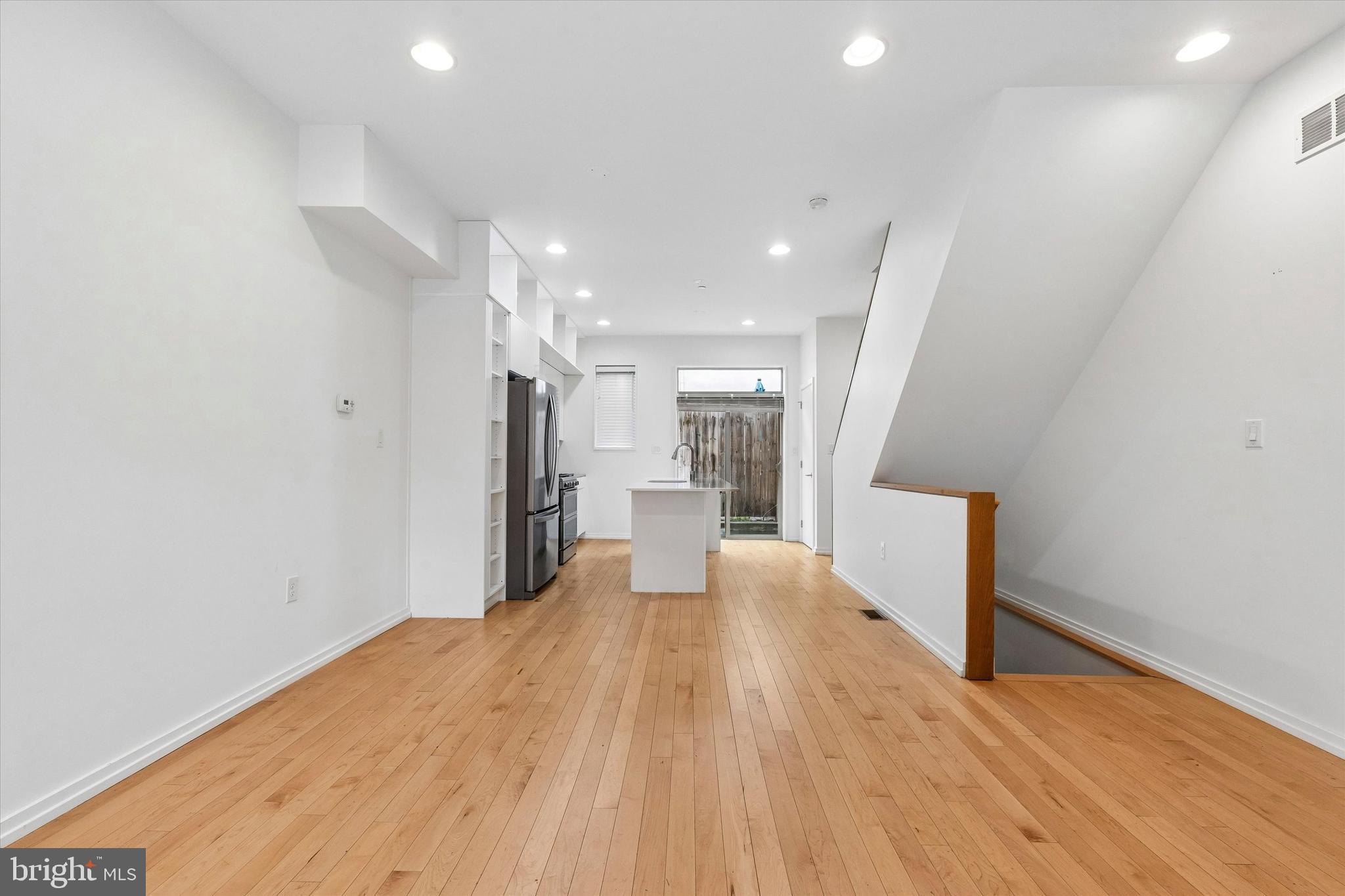 936 North Leithgow Street Philadelphia, PA 19123 - Photo 3 of 40 a view of a kitchen with wooden floor