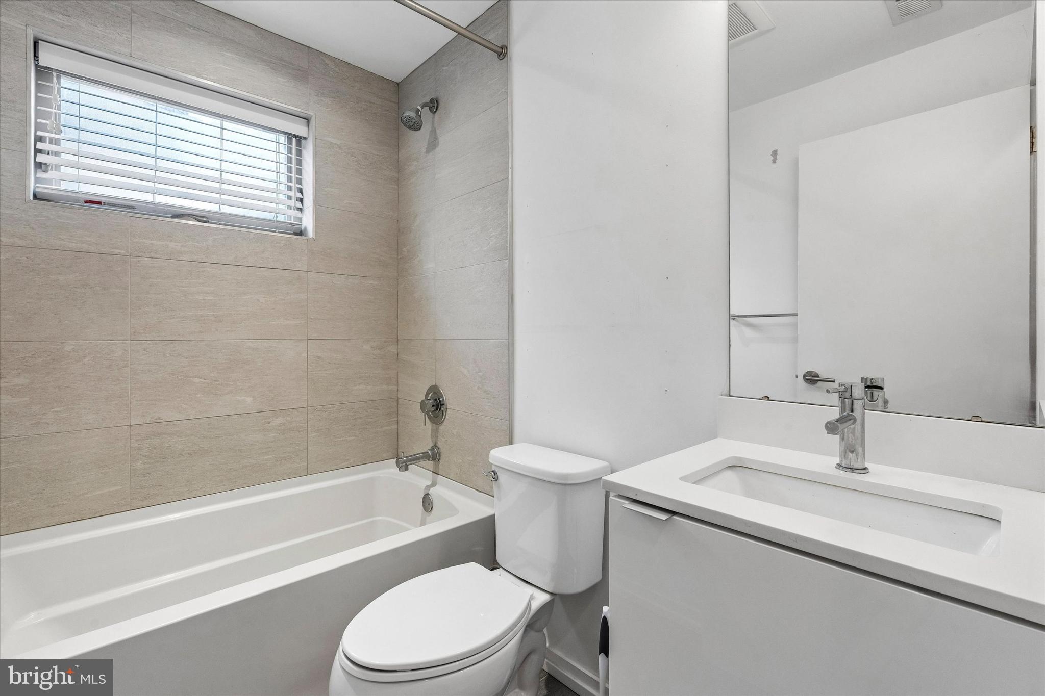 936 North Leithgow Street Philadelphia, PA 19123 - Photo 9 of 40 a bathroom with a sink toilet and bathtub