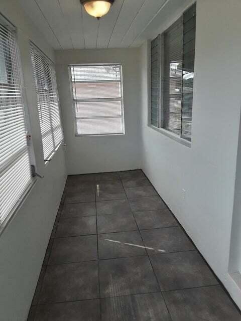 1340 West 33rd Street Riviera Beach, FL 33404 - Photo 11 of 11 a view of an empty room with a window