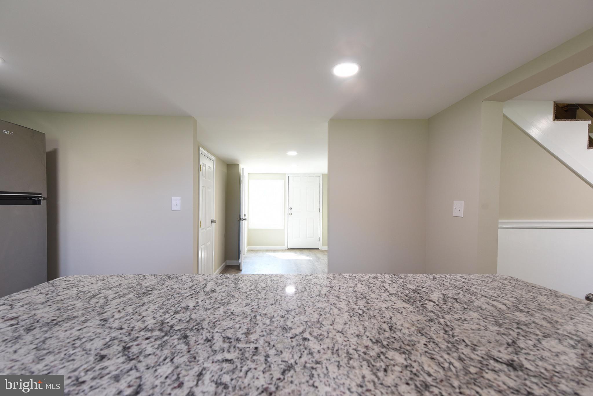 8833 Georgetown Road Chestertown, MD 21620 - Photo 11 of 47 a view of a big room with a refrigerator and wooden floor