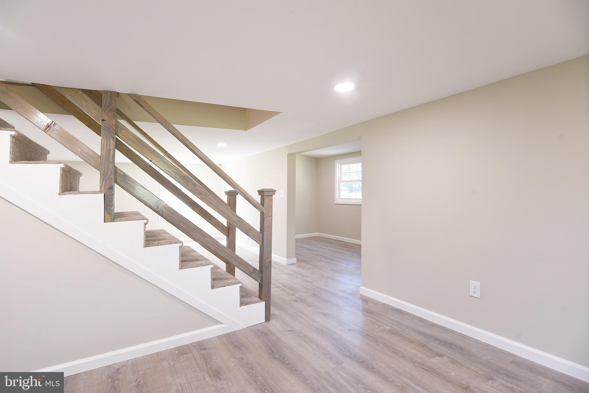 8833 Georgetown Road Chestertown, MD 21620 - Photo 14 of 47 a view of entryway with wooden floor and stairs