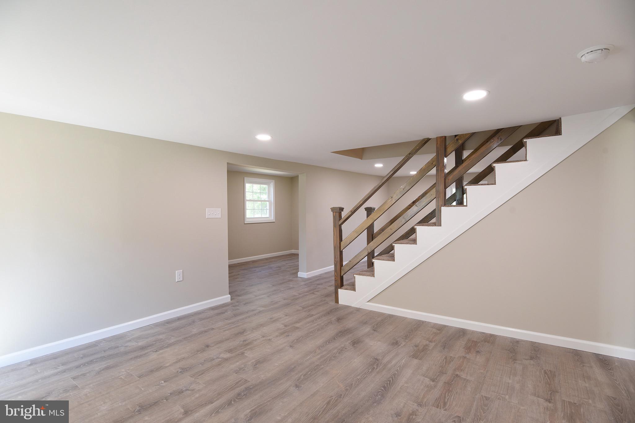 8833 Georgetown Road Chestertown, MD 21620 - Photo 16 of 47 a view of empty room with wooden floor and fan