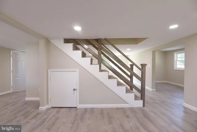 a view of an entryway with wooden floor