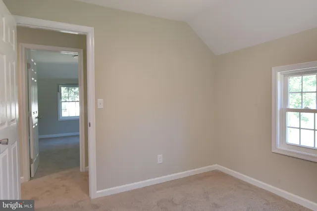 an empty room and windows