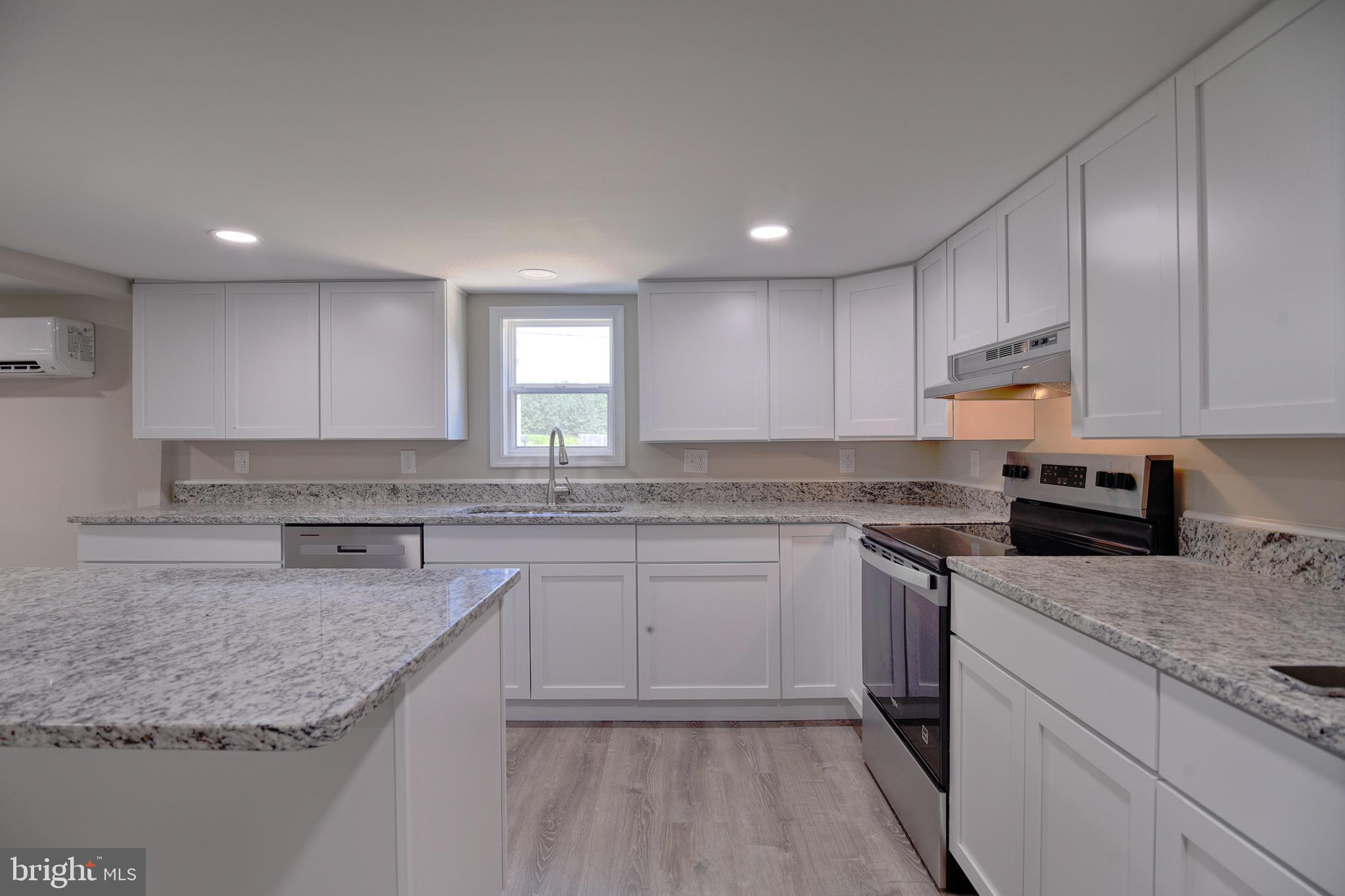 8833 Georgetown Road Chestertown, MD 21620 - Photo 3 of 47 a kitchen with stainless steel appliances granite countertop refrigerator sink and cabinets