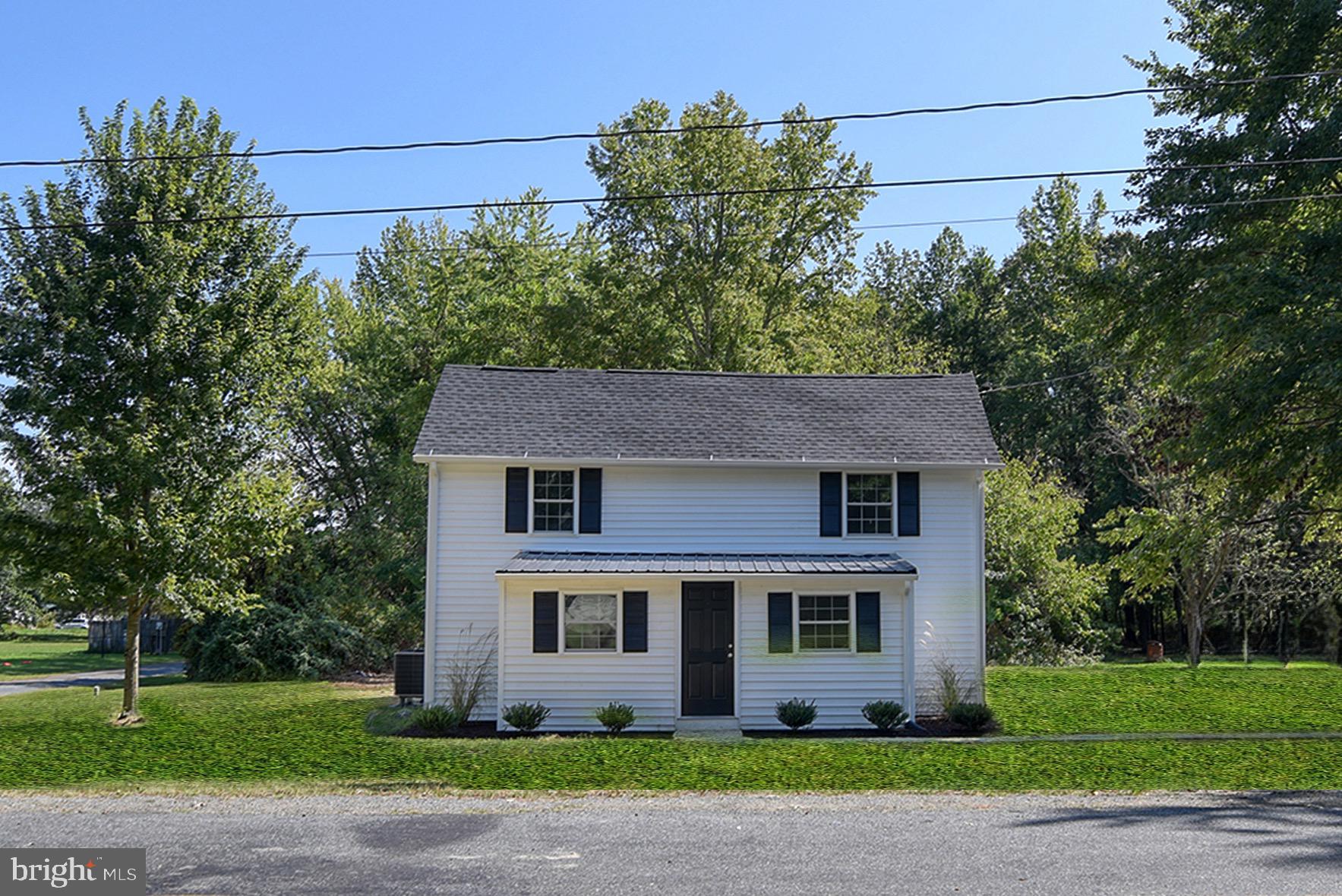 8833 Georgetown Road Chestertown, MD 21620 - Photo 34 of 47 a front view of a house with a garden