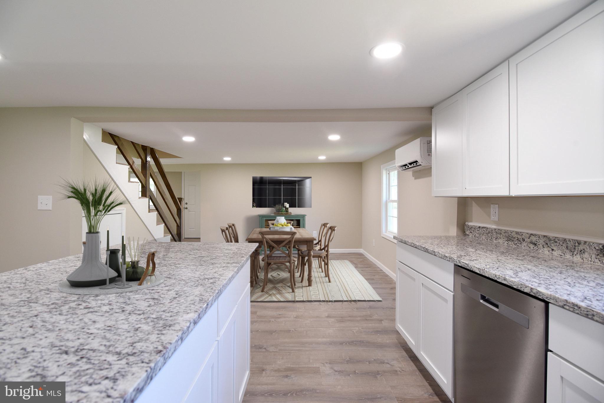 8833 Georgetown Road Chestertown, MD 21620 - Photo 7 of 47 a kitchen with sink a counter and chairs