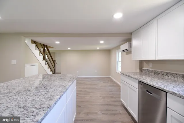 a view of a kitchen cabinets a sink and dishwasher in a kitchen