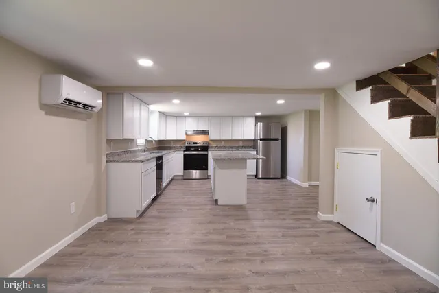 a view of kitchen with wooden floor