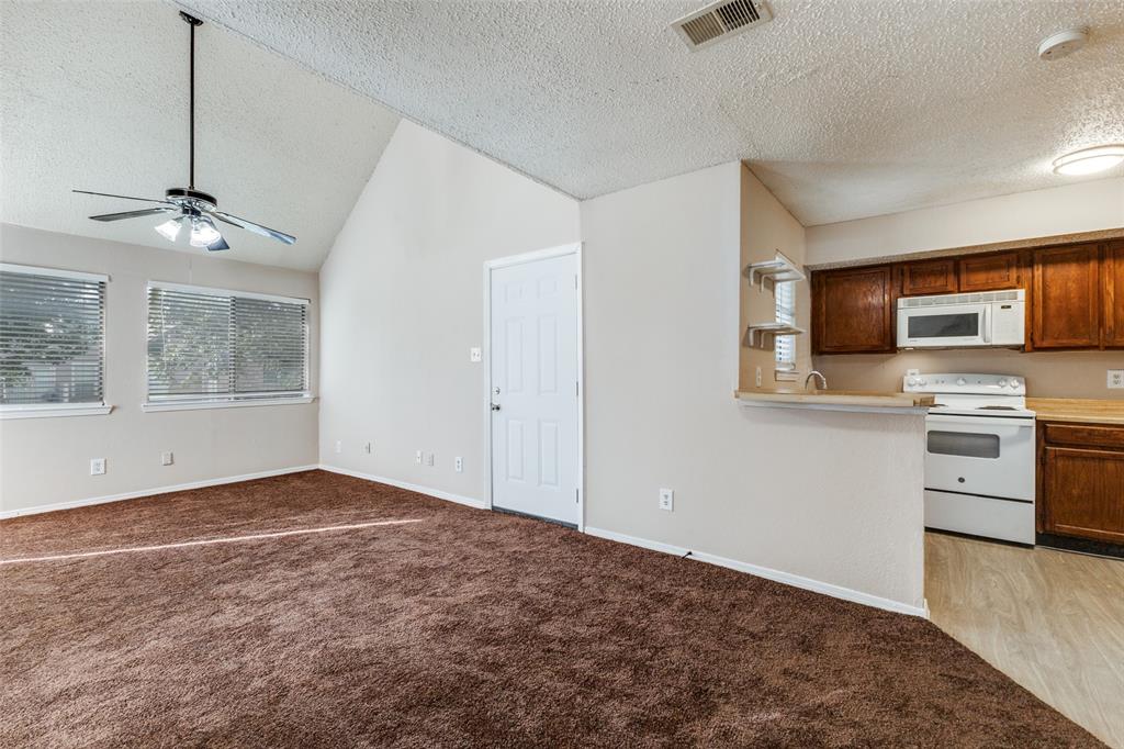 9833 Walnut Street, Unit 203 Dallas, TX 75243 - Photo 19 of 19 a view of a kitchen with a sink cabinets and wooden floor