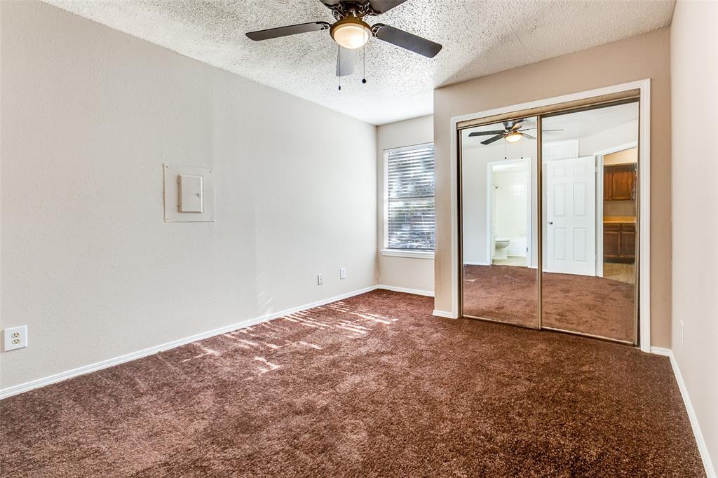 9833 Walnut Street, Unit 203 Dallas, TX 75243 - Photo 11 of 19 an empty room with fan