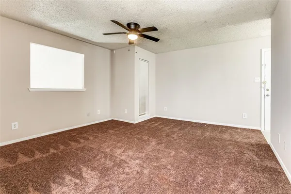 an empty room with fan