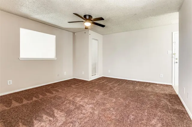 an empty room with fan