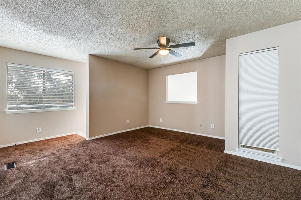 9833 Walnut Street, Unit 203 Dallas, TX 75243 - Photo 13 of 19 an empty room with windows and fan