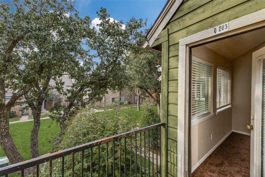 9833 Walnut Street, Unit 203 Dallas, TX 75243 - Photo 18 of 19 a view of a balcony with a tree