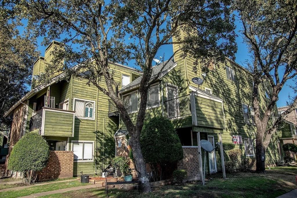9833 Walnut Street, Unit 203 Dallas, TX 75243 - Photo 2 of 19 a front view of a house with a tree