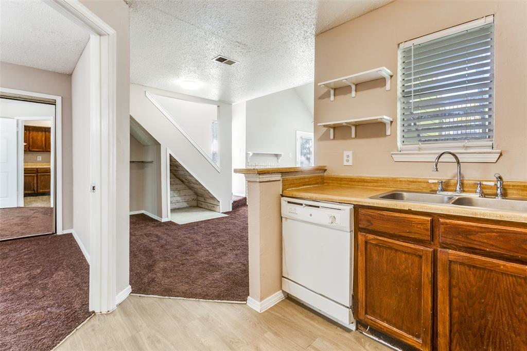 9833 Walnut Street, Unit 203 Dallas, TX 75243 - Photo 8 of 19 a bathroom with a sink and a mirror