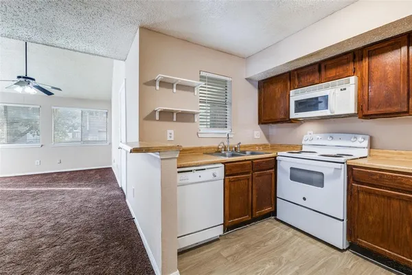 a kitchen with a stove and a sink