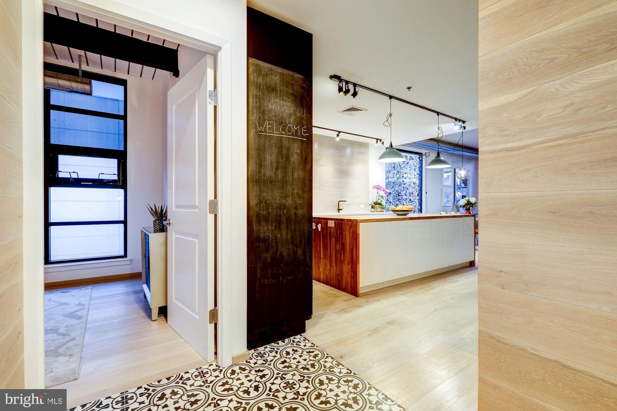 2125 14th Street Northwest, Unit 315W Washington, DC 20009 - Photo 2 of 35 a view of a kitchen from the hallway