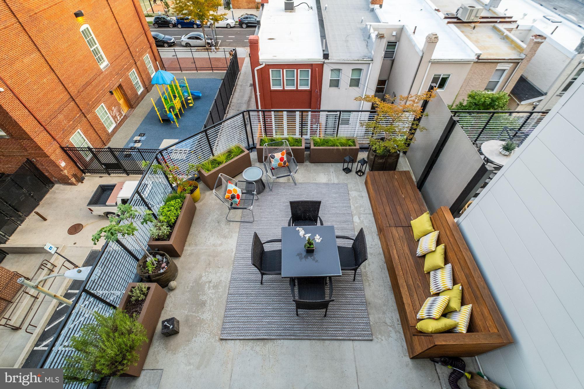 2125 14th Street Northwest, Unit 315W Washington, DC 20009 - Photo 14 of 35 an aerial view of residential houses with outdoor space