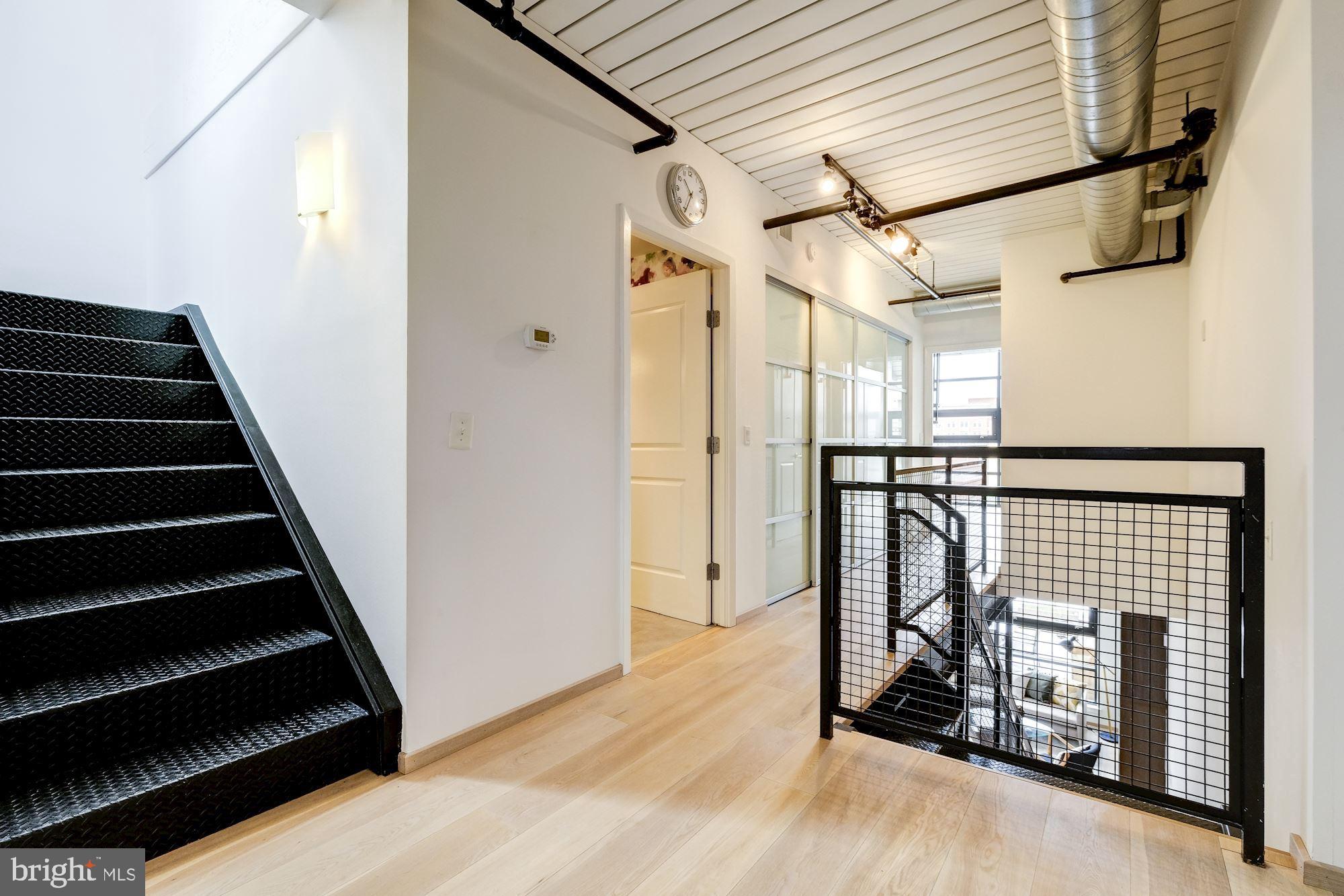2125 14th Street Northwest, Unit 315W Washington, DC 20009 - Photo 24 of 35 a view of entryway with wooden floor and stairs