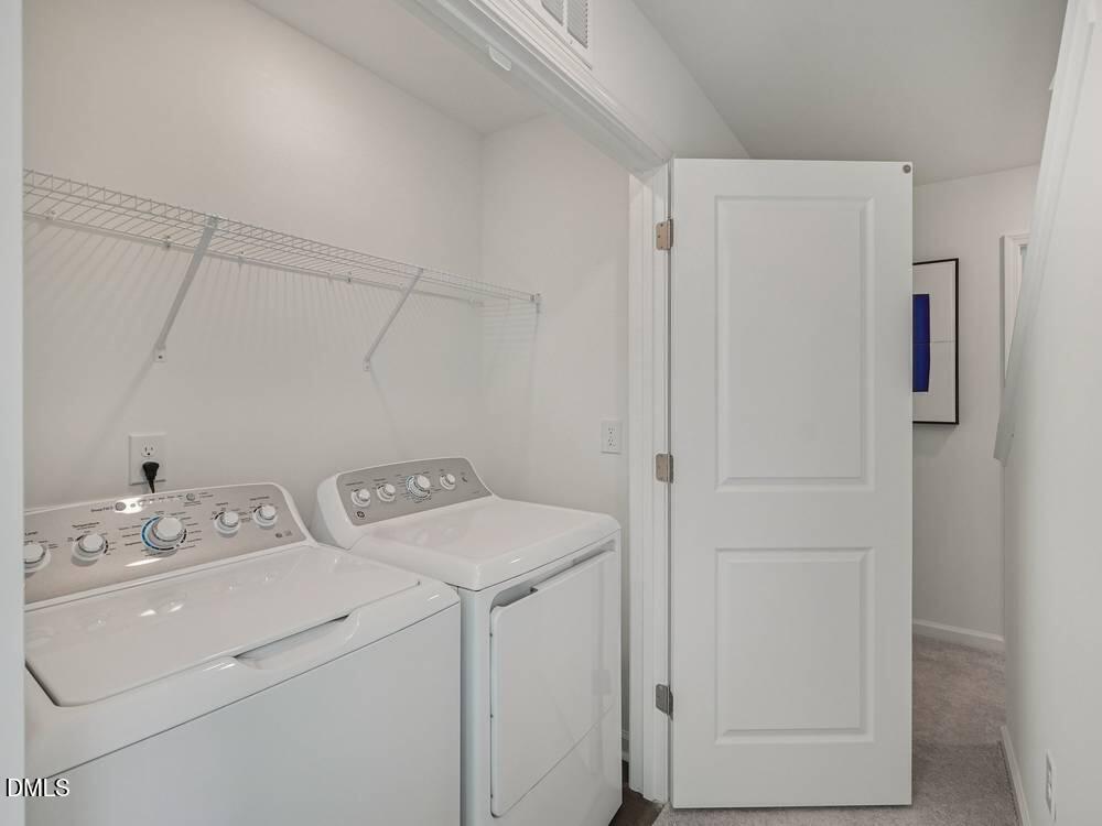 3101 White Blossom Court, Unit SAVANNAH 3103 Raleigh, NC 27610 - Photo 15 of 20 a utility room with dryer and washer