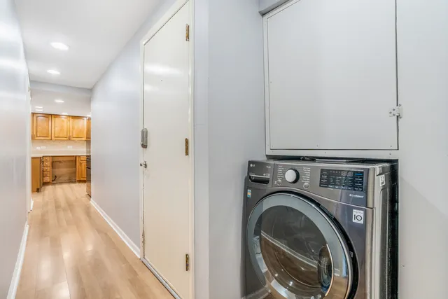 a view of a hallway with washer and dryer